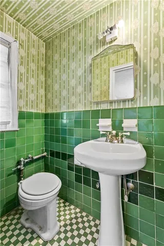 a bathroom with a sink a mirror and a shower