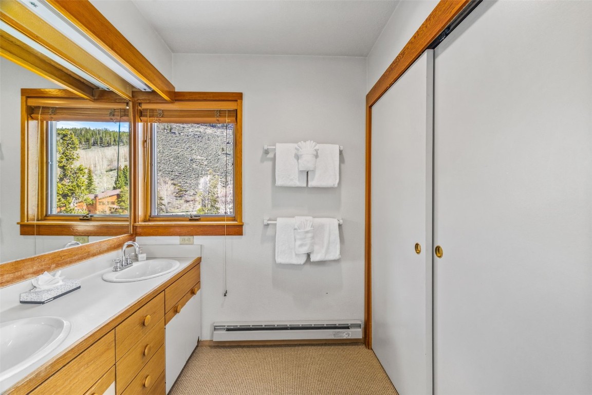 240 Tennis Club Road, Unit 1677 Keystone, CO 80435 - Photo 25 of 46 Bathroom with baseboard heating and double vanity