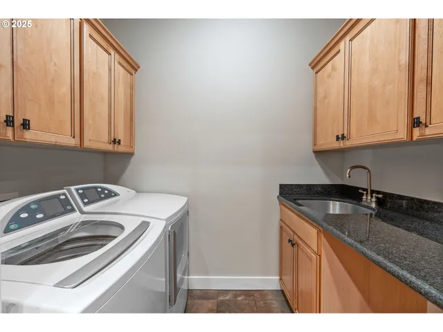 a kitchen that has a sink and a stove