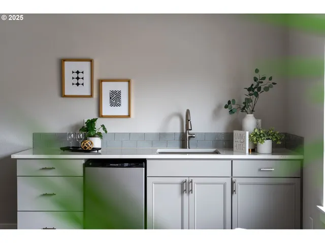a kitchen with a sink and cabinets
