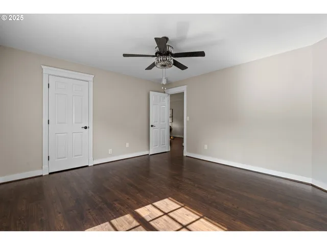 a view of an empty room and wooden floor