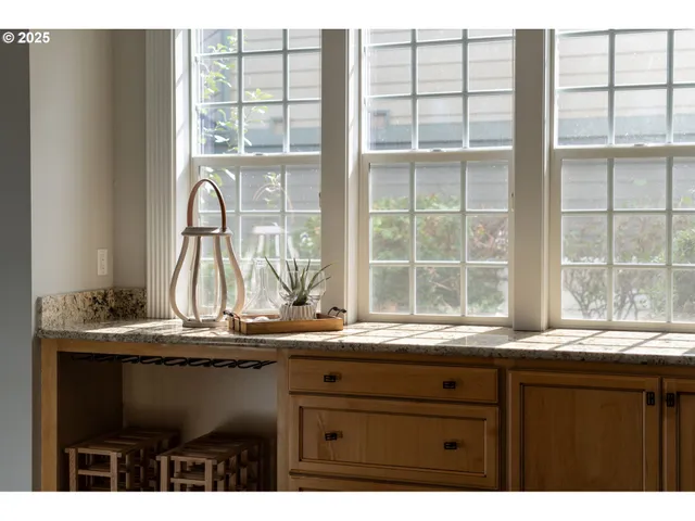 a kitchen with granite countertop a window and a sink
