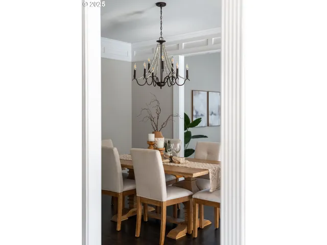 a dining room with a table and chairs