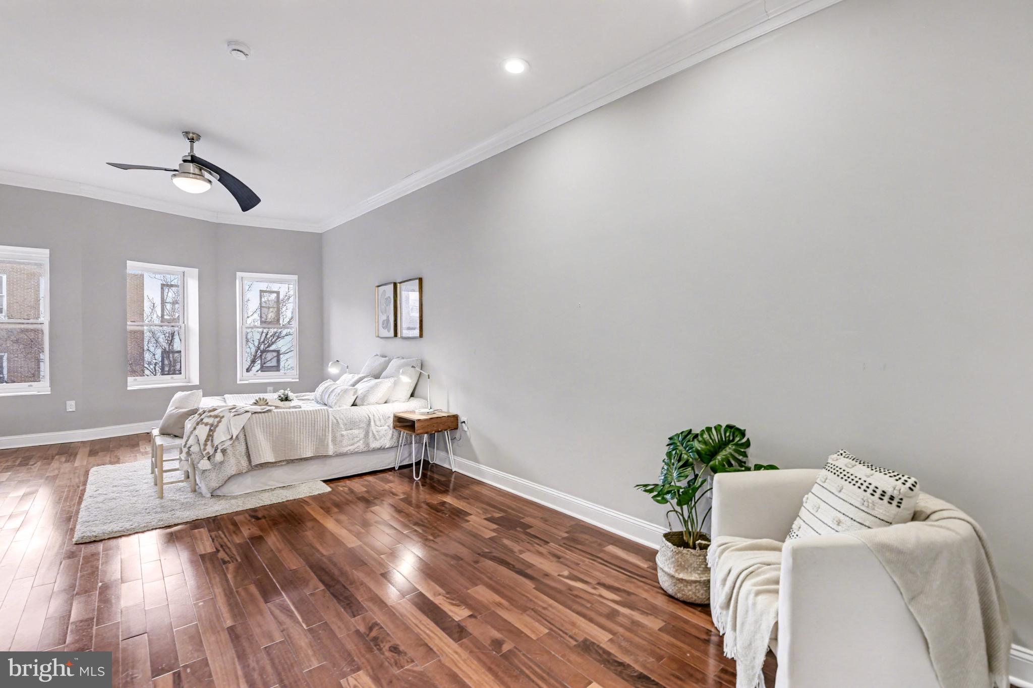 1431 Madison Avenue Baltimore, MD 21217 - Photo 24 of 38 a living room with furniture and wooden floor