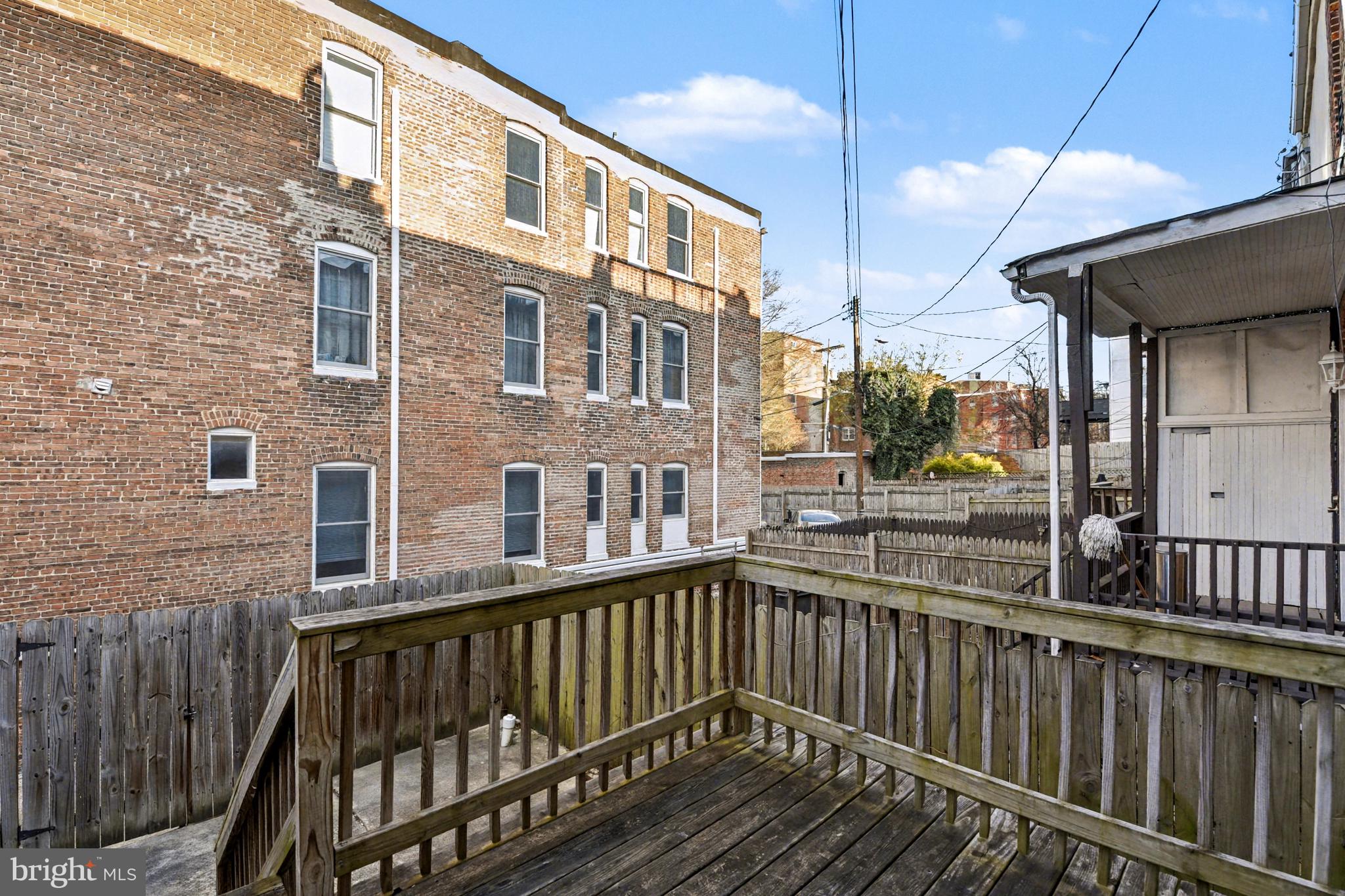 1431 Madison Avenue Baltimore, MD 21217 - Photo 31 of 38 a view of a brick building from a balcony