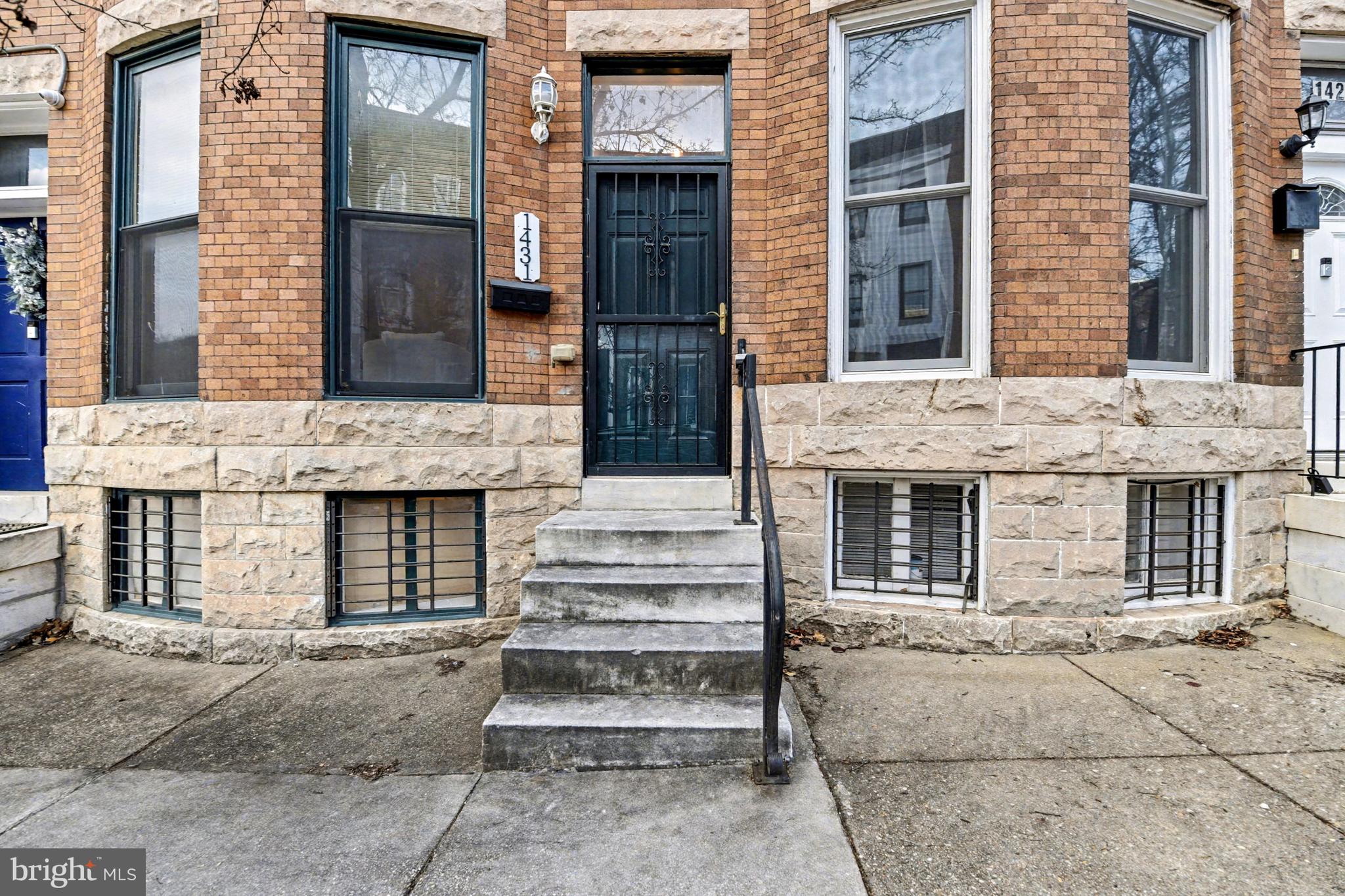 1431 Madison Avenue Baltimore, MD 21217 - Photo 38 of 38 a front view of a house with a garage