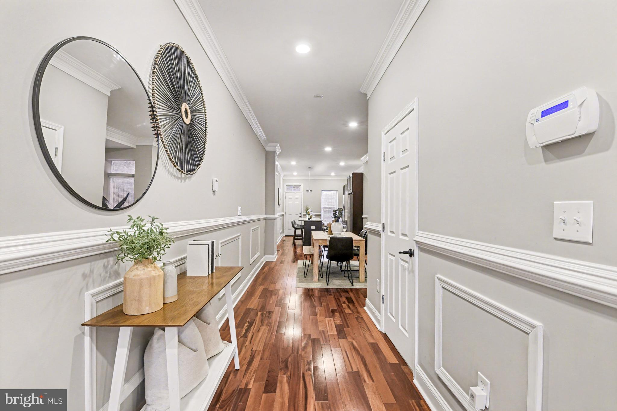 1431 Madison Avenue Baltimore, MD 21217 - Photo 4 of 38 a very nice looking room with a large mirror and furniture