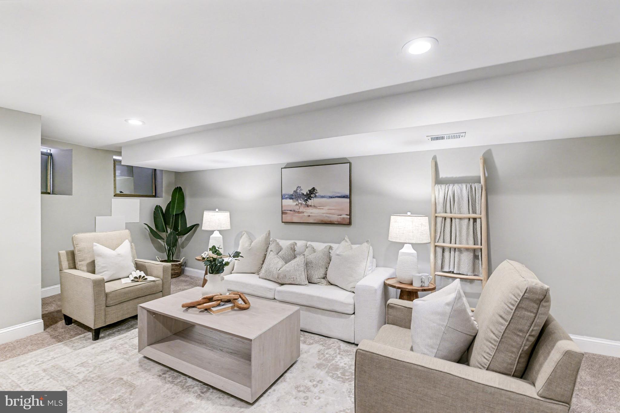 1431 Madison Avenue Baltimore, MD 21217 - Photo 5 of 38 a living room with furniture and a wooden floor