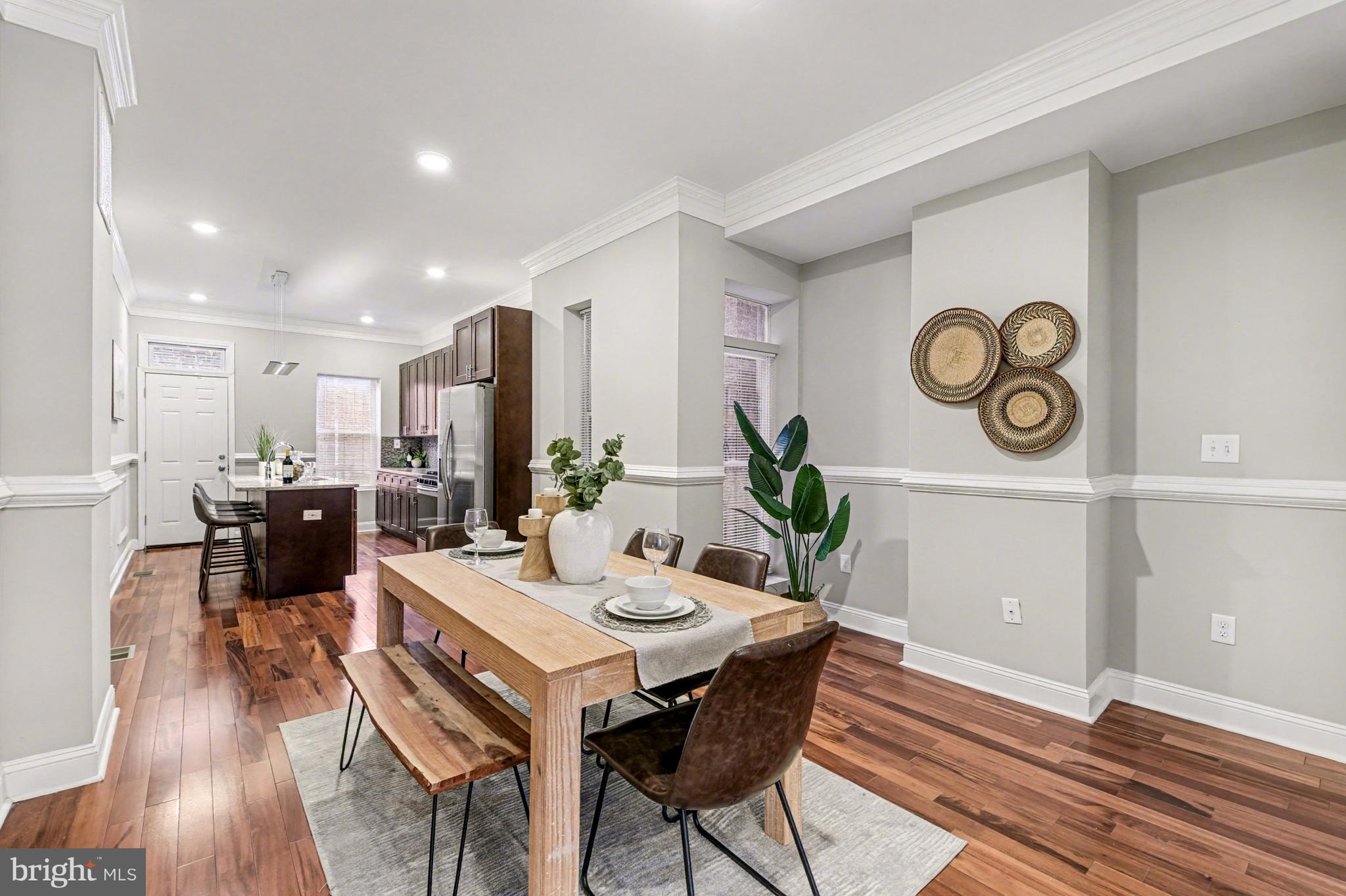 1431 Madison Avenue Baltimore, MD 21217 - Photo 6 of 38 a view of a dining room with furniture and wooden floor