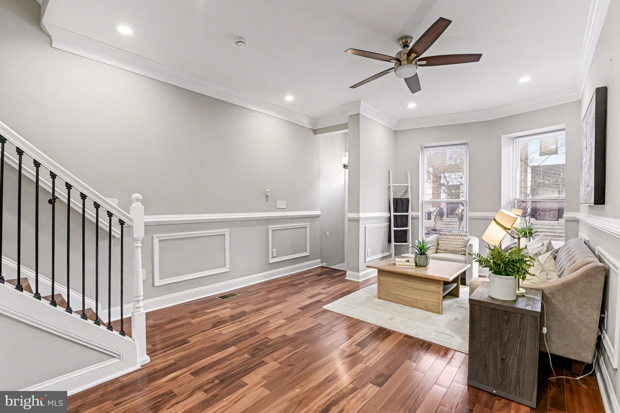 1431 Madison Avenue Baltimore, MD 21217 - Photo 8 of 38 a living room with furniture and a wooden floor