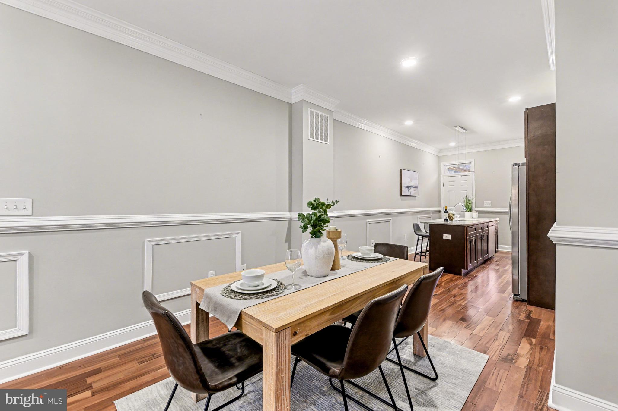 1431 Madison Avenue Baltimore, MD 21217 - Photo 9 of 38 a view of a dining room with furniture and wooden floor