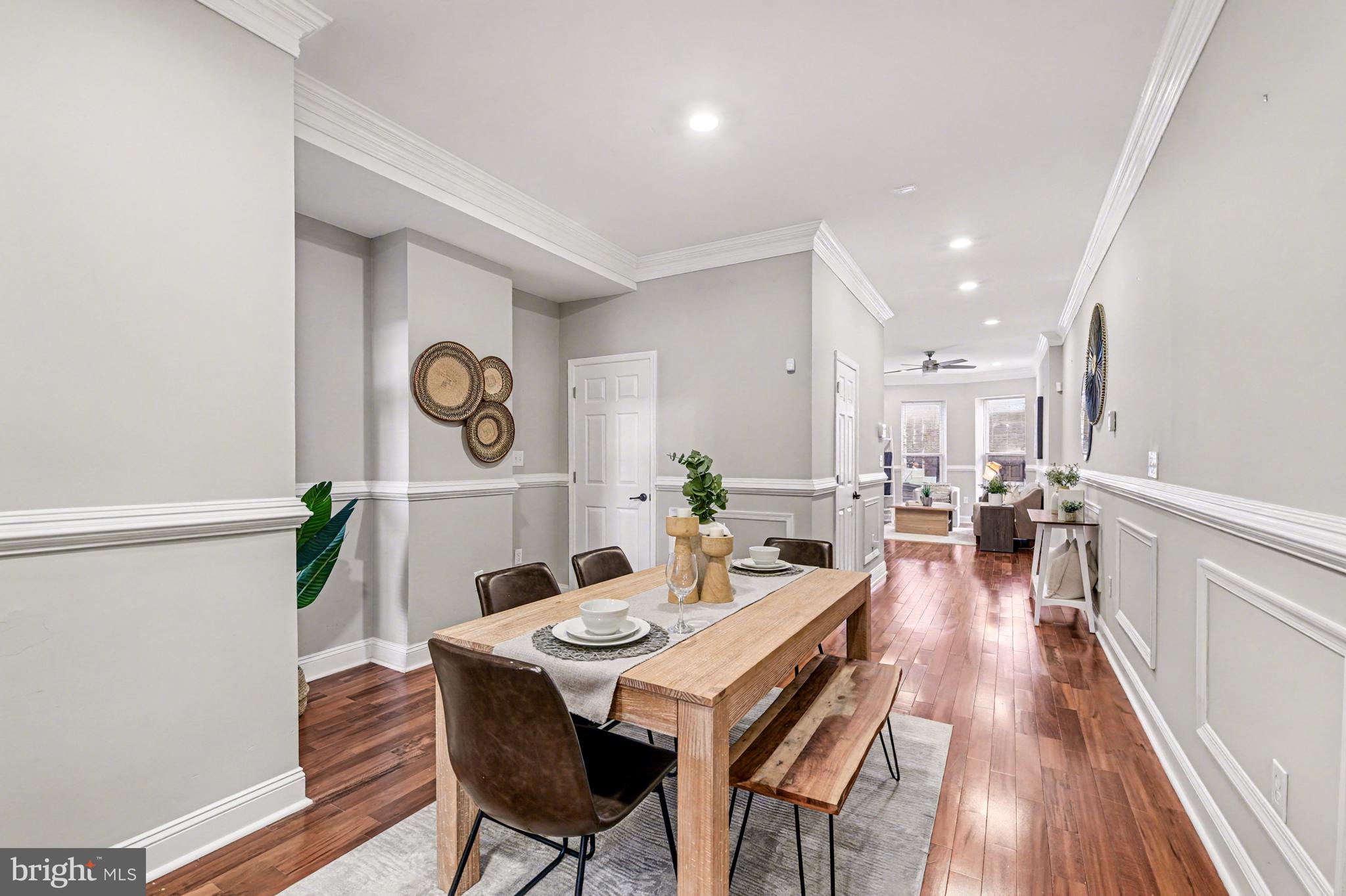 1431 Madison Avenue Baltimore, MD 21217 - Photo 10 of 38 a view of a dining room with furniture and wooden floor