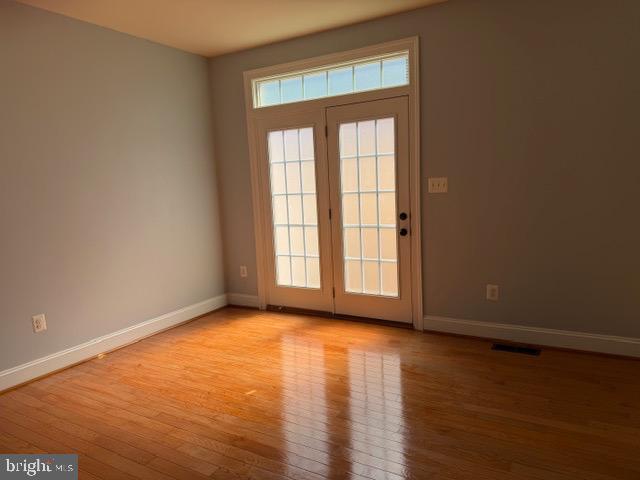 3990 Cephas Child Road Doylestown, PA 18902 - Photo 13 of 53 an empty room with wooden floor and windows