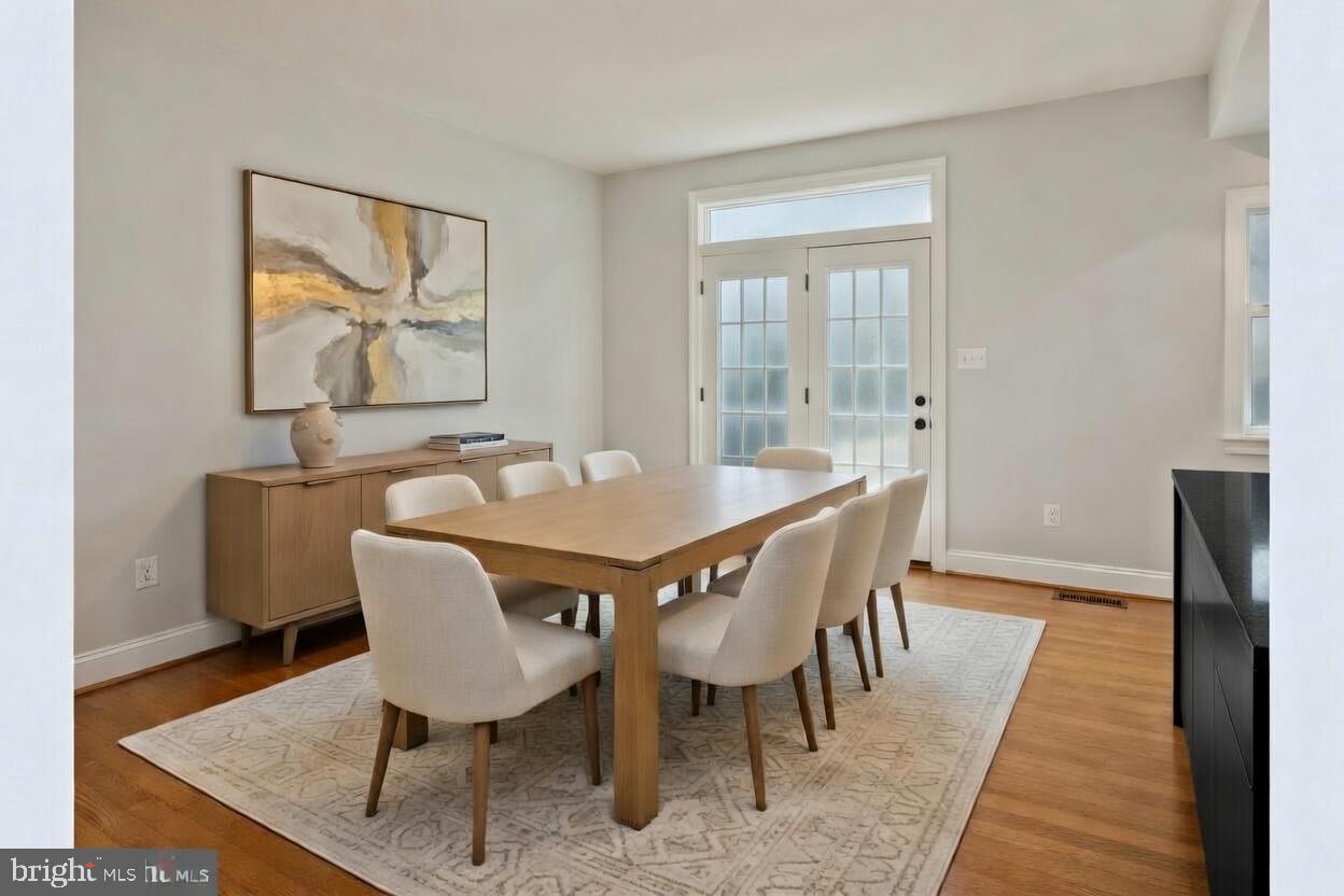 3990 Cephas Child Road Doylestown, PA 18902 - Photo 14 of 53 a view of a dining room with furniture and wooden floor