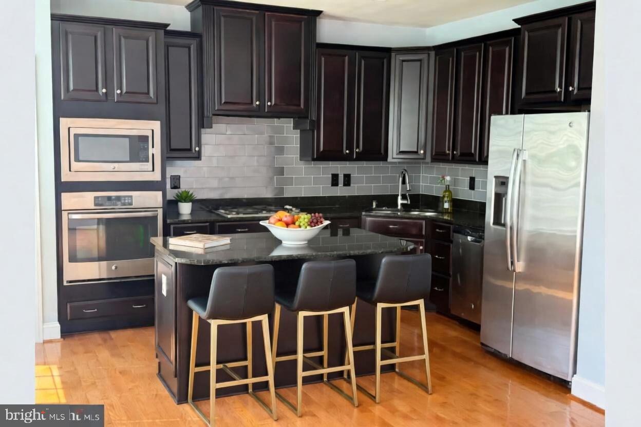 3990 Cephas Child Road Doylestown, PA 18902 - Photo 16 of 53 a kitchen with stainless steel appliances granite countertop a refrigerator a stove a sink and dishwasher