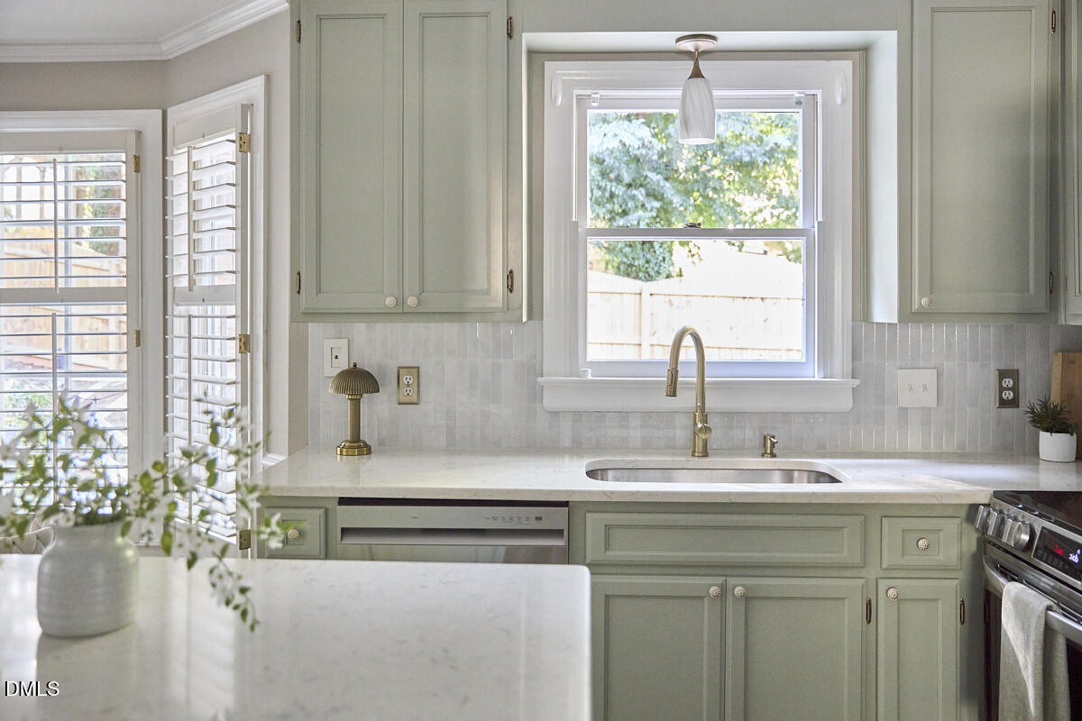 6725 Eastbrook Drive Raleigh, NC 27615 - Photo 12 of 48 a kitchen with a sink and a window