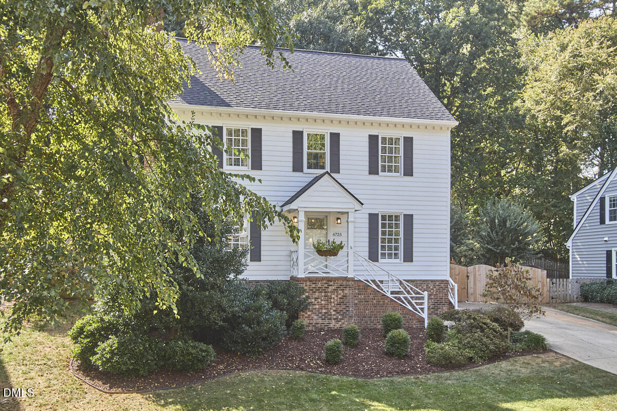 6725 Eastbrook Drive Raleigh, NC 27615 - Photo 2 of 48 a front view of a house with a yard
