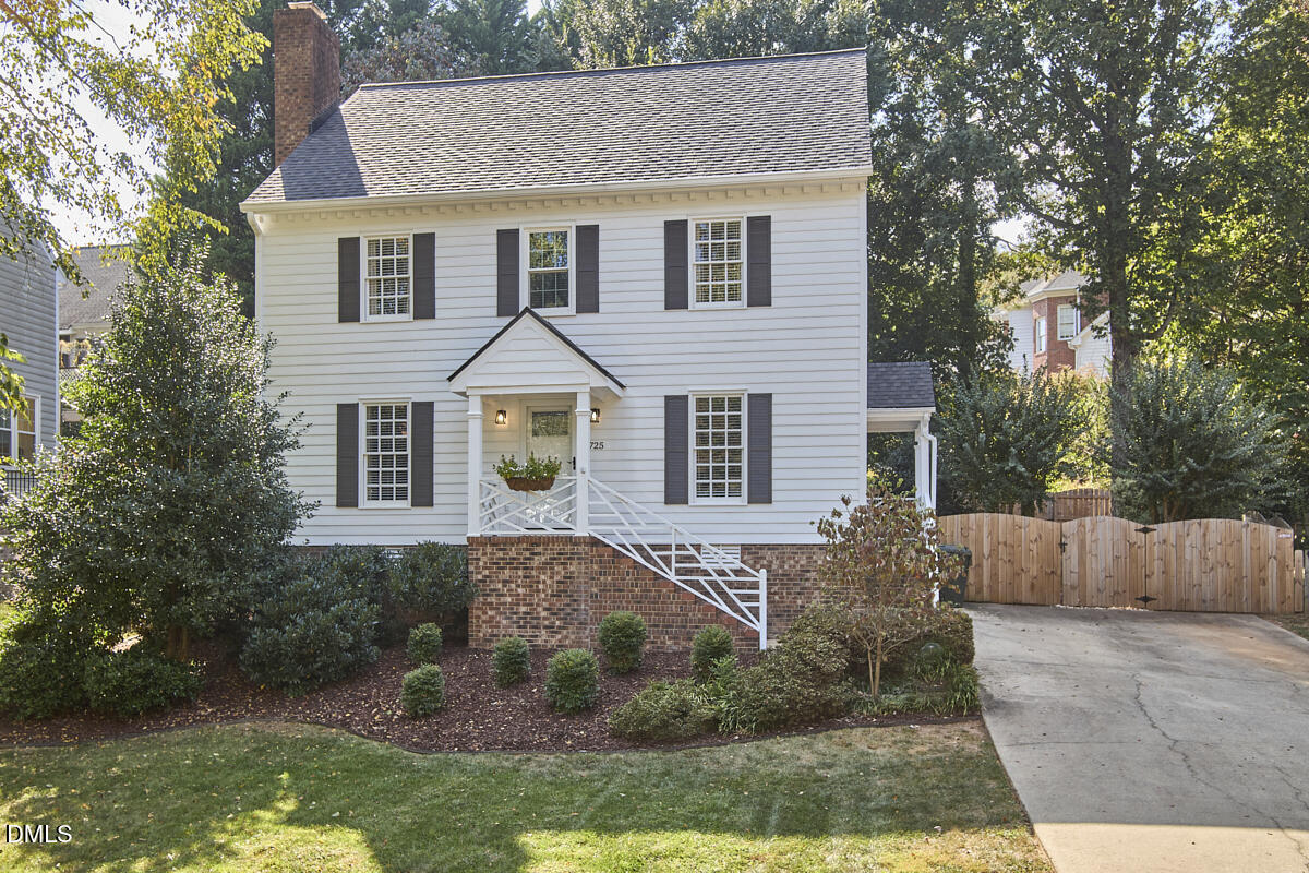 6725 Eastbrook Drive Raleigh, NC 27615 - Photo 3 of 48 a front view of a house with a yard