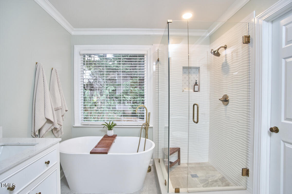 6725 Eastbrook Drive Raleigh, NC 27615 - Photo 32 of 48 a bath room with a bath tub and a sink