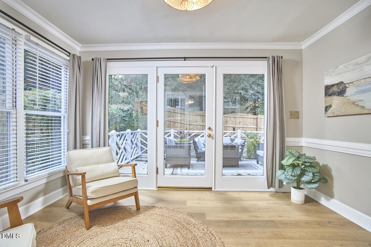 6725 Eastbrook Drive Raleigh, NC 27615 - Photo 42 of 48 a living room filled with furniture and a potted plant