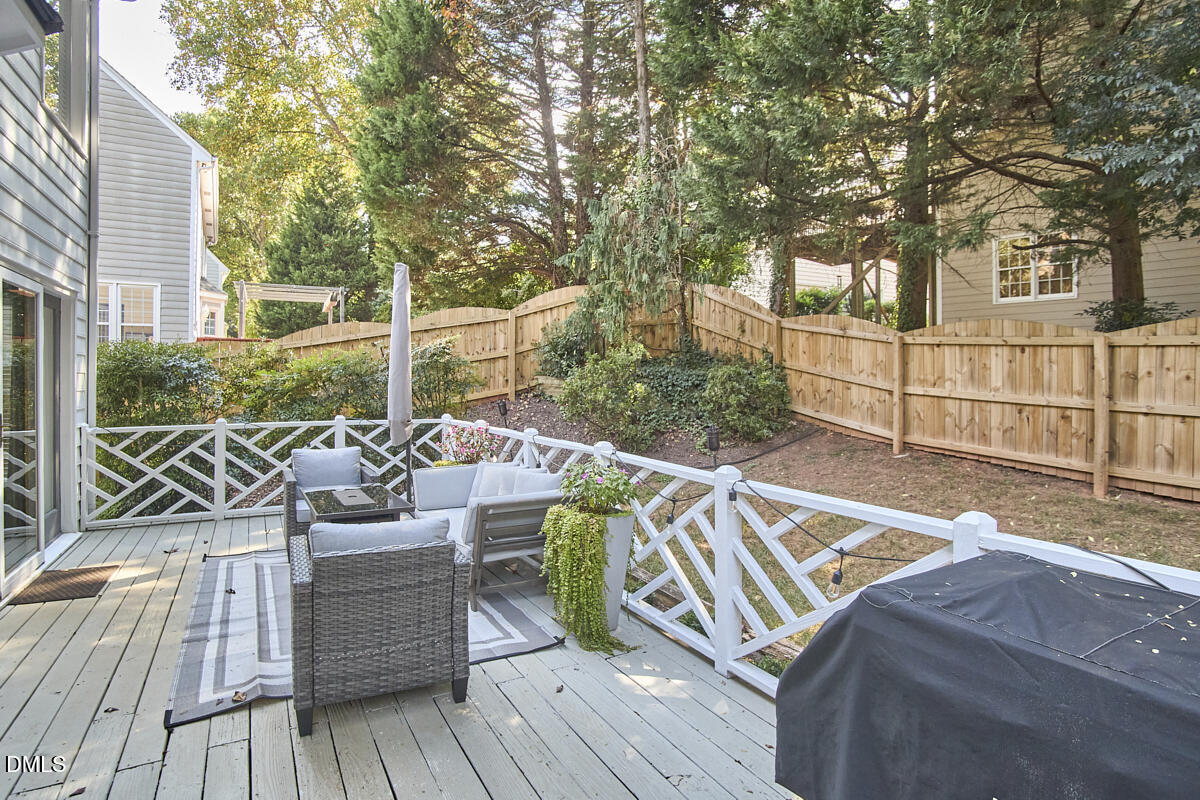 6725 Eastbrook Drive Raleigh, NC 27615 - Photo 43 of 48 a view of balcony with wooden floor and outdoor seating