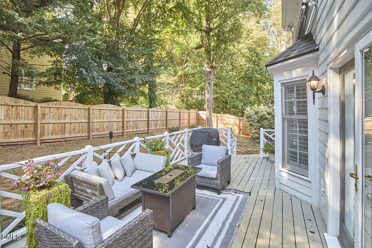 6725 Eastbrook Drive Raleigh, NC 27615 - Photo 44 of 48 a balcony with furniture and wooden floor