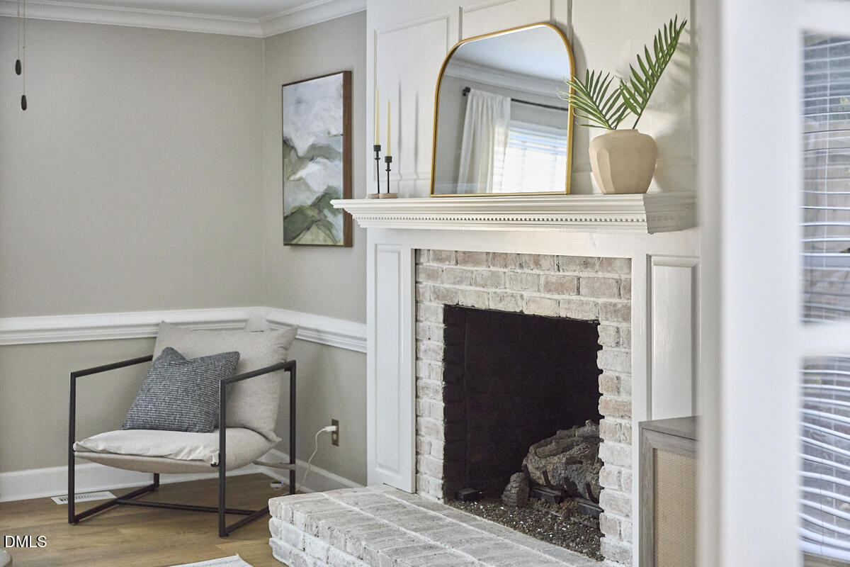 6725 Eastbrook Drive Raleigh, NC 27615 - Photo 7 of 48 a living room with furniture and a fireplace