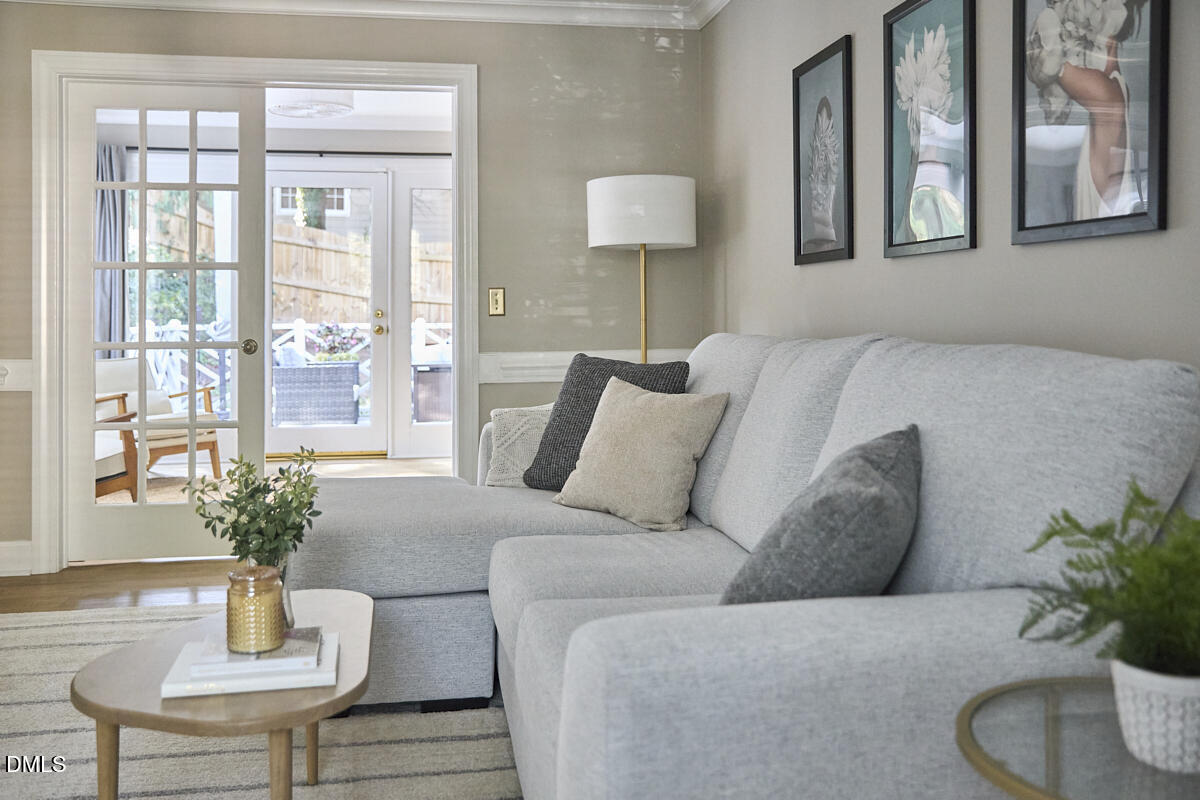 6725 Eastbrook Drive Raleigh, NC 27615 - Photo 8 of 48 a living room with furniture and a potted plant