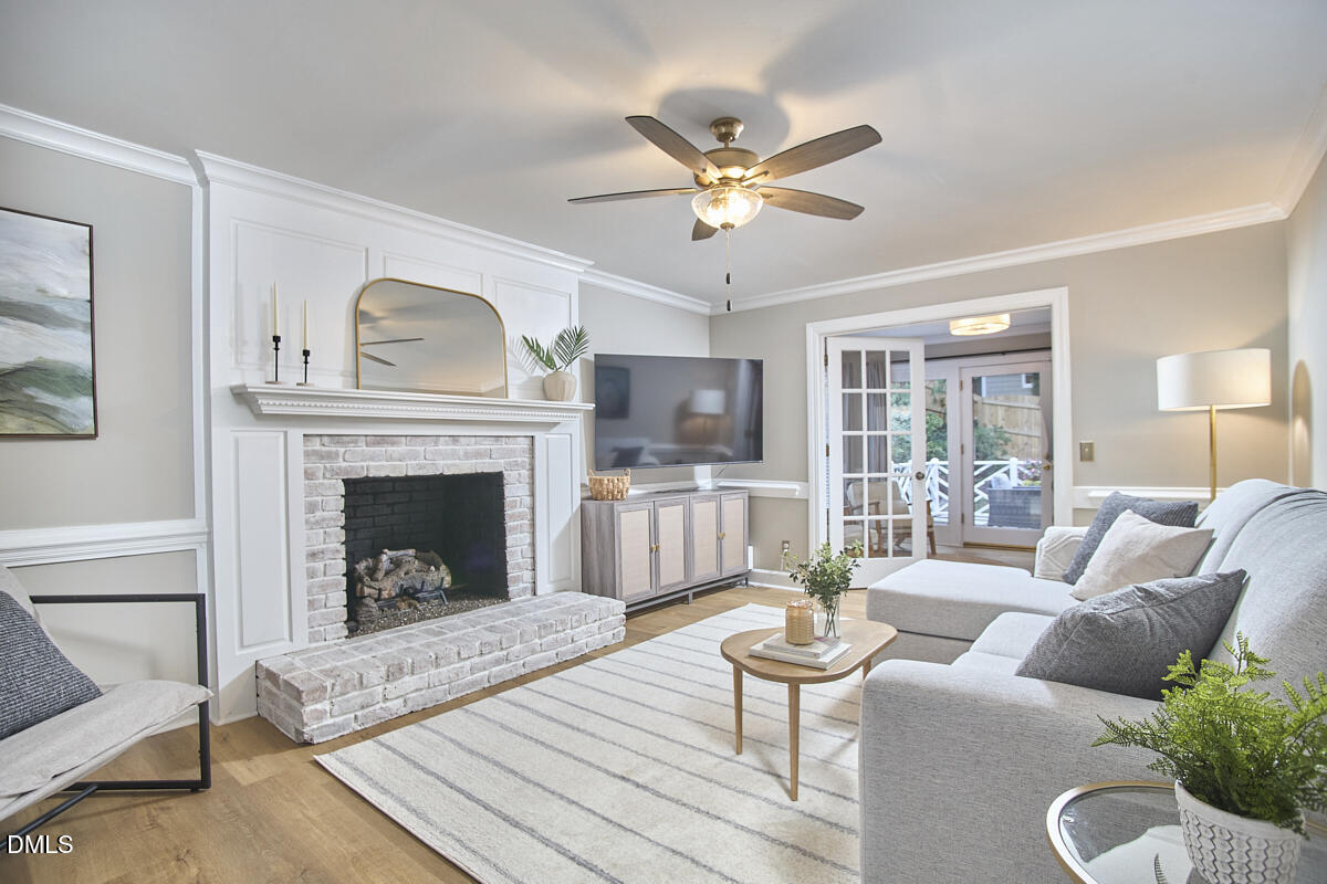 6725 Eastbrook Drive Raleigh, NC 27615 - Photo 9 of 48 a living room with furniture and a fireplace