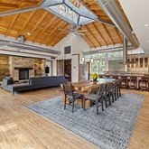 a dining room with wooden floor windows and a glass table