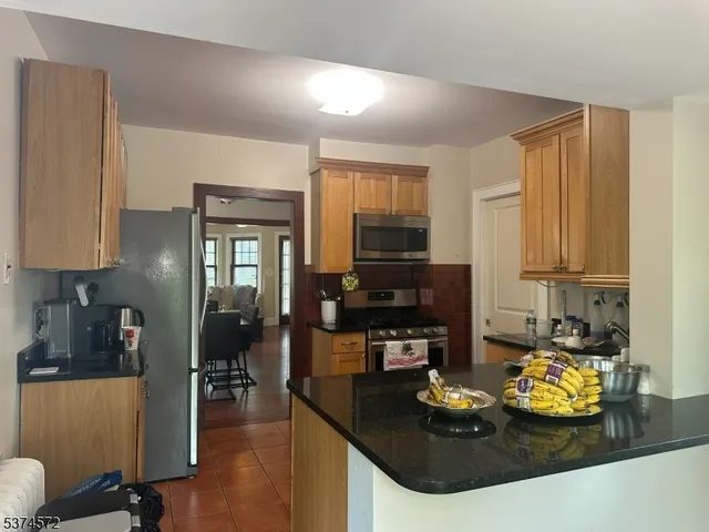 a kitchen with sink and refrigerator