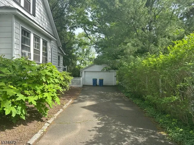 a view of a house with a tree