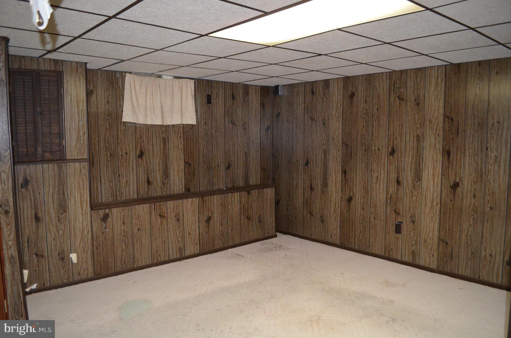 657 South Wickham Road Baltimore, MD 21229 - Photo 12 of 17 Fully finished lower level with door to yard