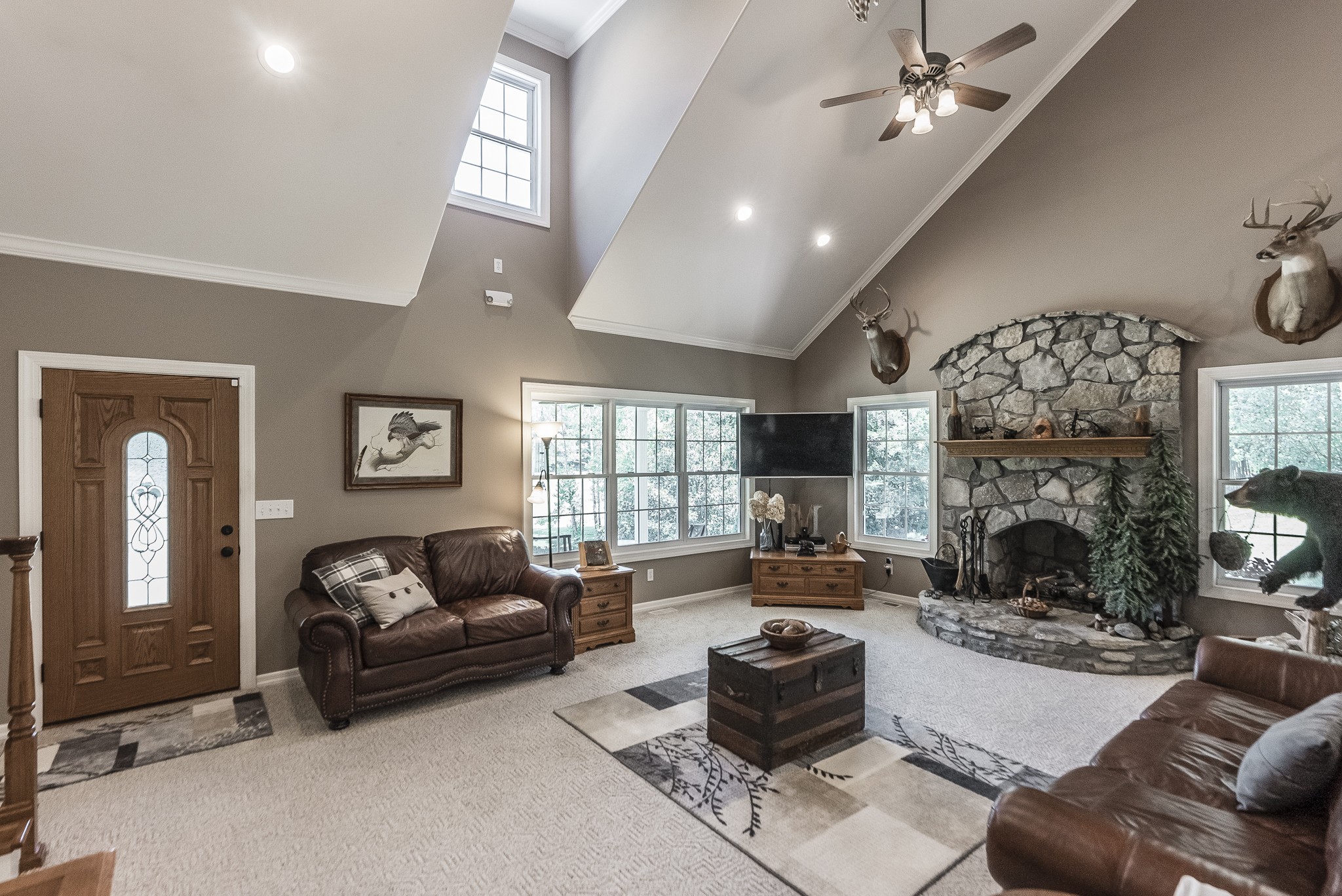 443 Mt Vernon Road Bethpage, TN 37022 - Photo 15 of 40 a living room with furniture a fireplace and a chandelier