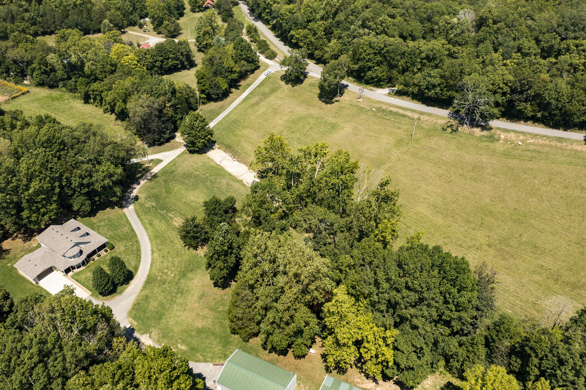 443 Mt Vernon Road Bethpage, TN 37022 - Photo 33 of 40 an aerial view of residential house with swimming pool and lawn chairs