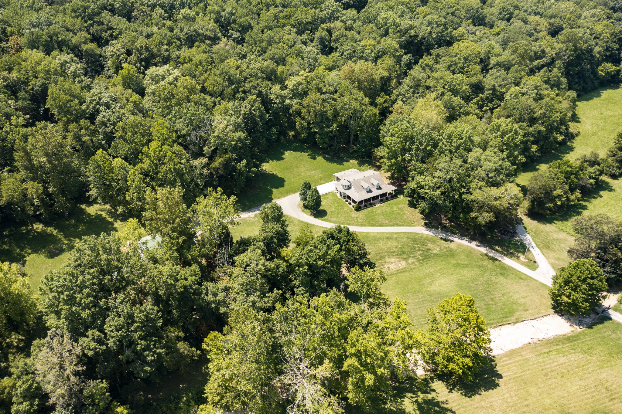 443 Mt Vernon Road Bethpage, TN 37022 - Photo 36 of 40 a view of a lake with a house
