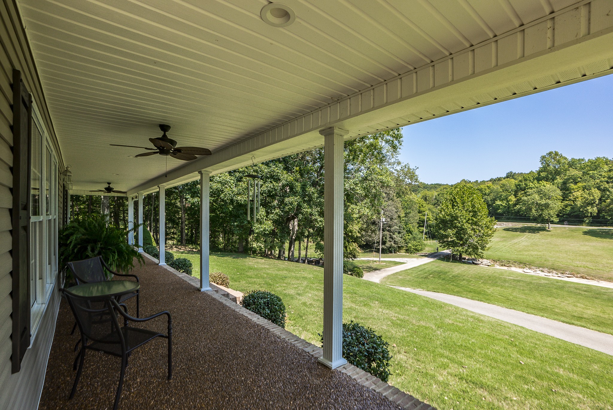 443 Mt Vernon Road Bethpage, TN 37022 - Photo 8 of 40 a view of a patio with table and chairs potted plants with wooden floor