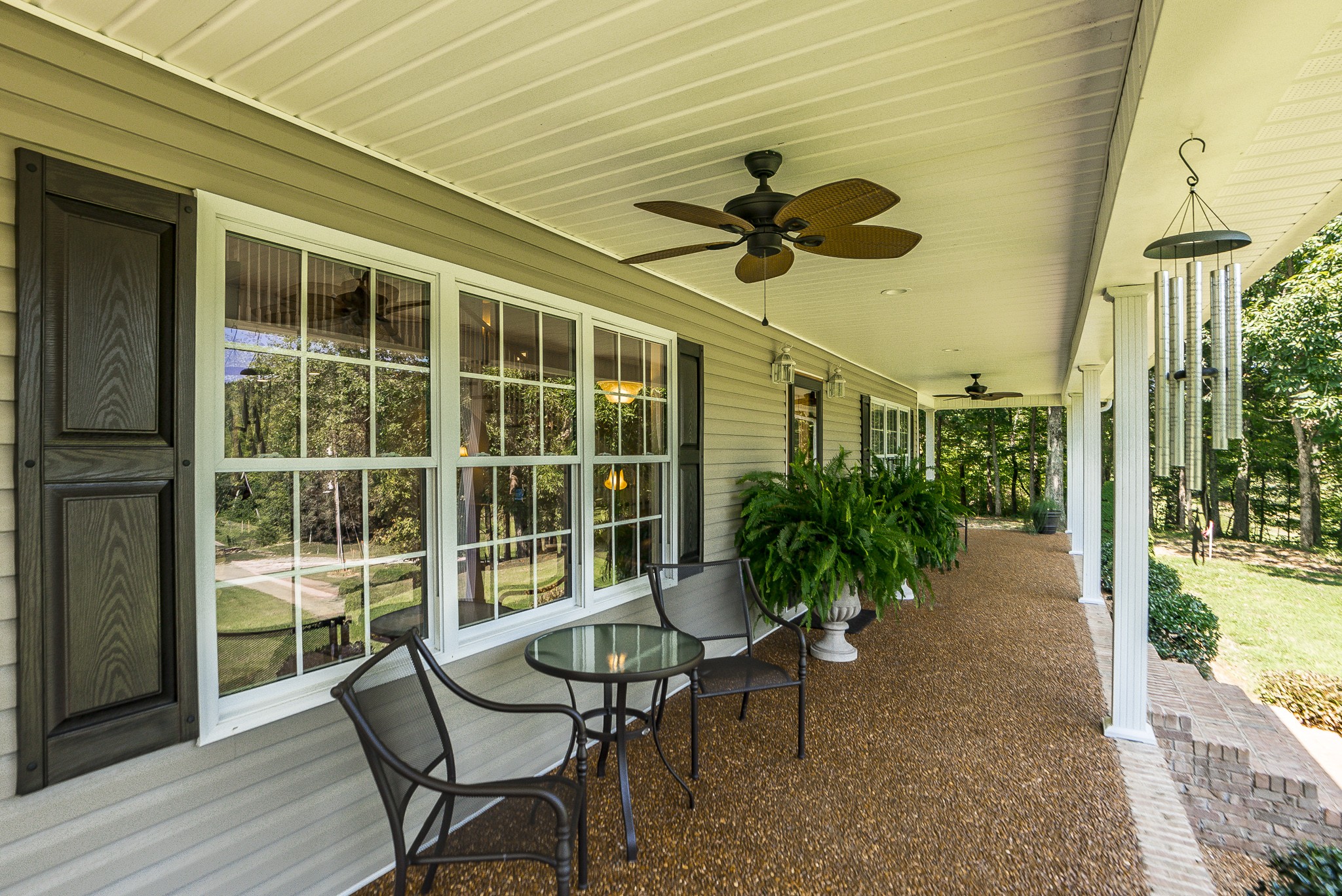 443 Mt Vernon Road Bethpage, TN 37022 - Photo 9 of 40 a view of a porch with chairs and potted plants