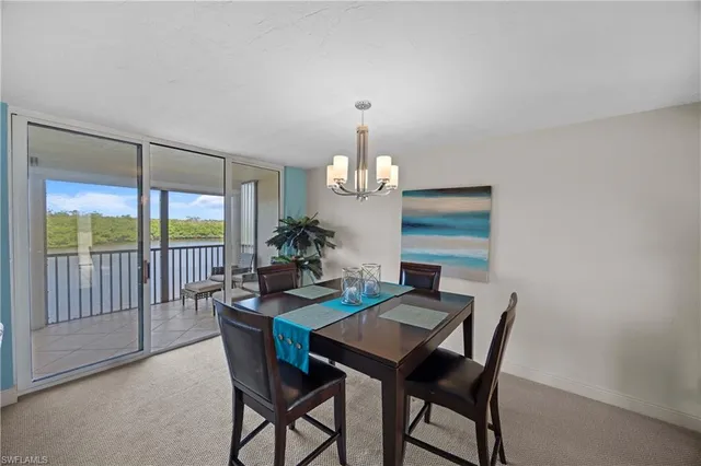 a view of a livingroom with furniture and a dining table