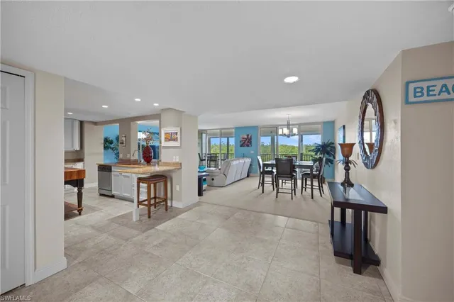 a view of a livingroom with furniture and mirror