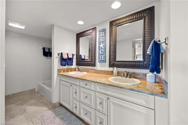 a bathroom with a toilet a sink and shower