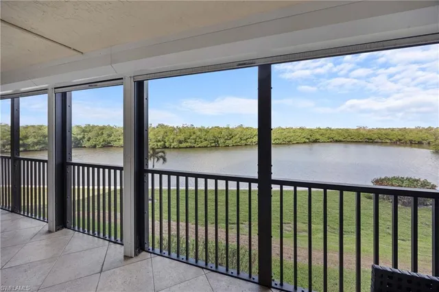 a view of a balcony with lake and mountain view
