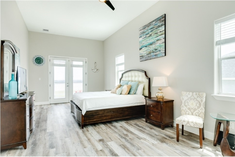 23327 Termini-San Luis Pass Road Galveston, TX 77554 - Photo 15 of 39 a bed sitting in a bedroom next to a window