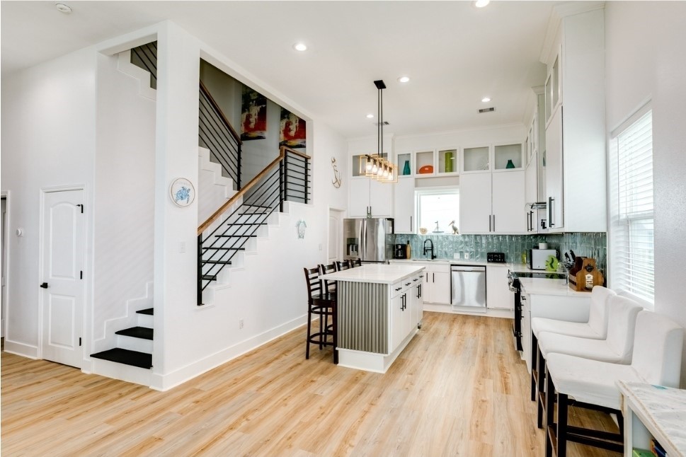 23327 Termini-San Luis Pass Road Galveston, TX 77554 - Photo 18 of 39 a view of kitchen with furniture and wooden floor