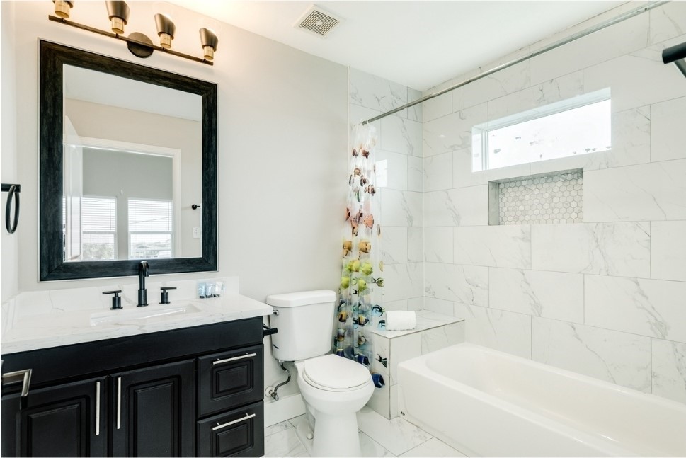23327 Termini-San Luis Pass Road Galveston, TX 77554 - Photo 24 of 39 a bathroom with a sink a toilet and shower
