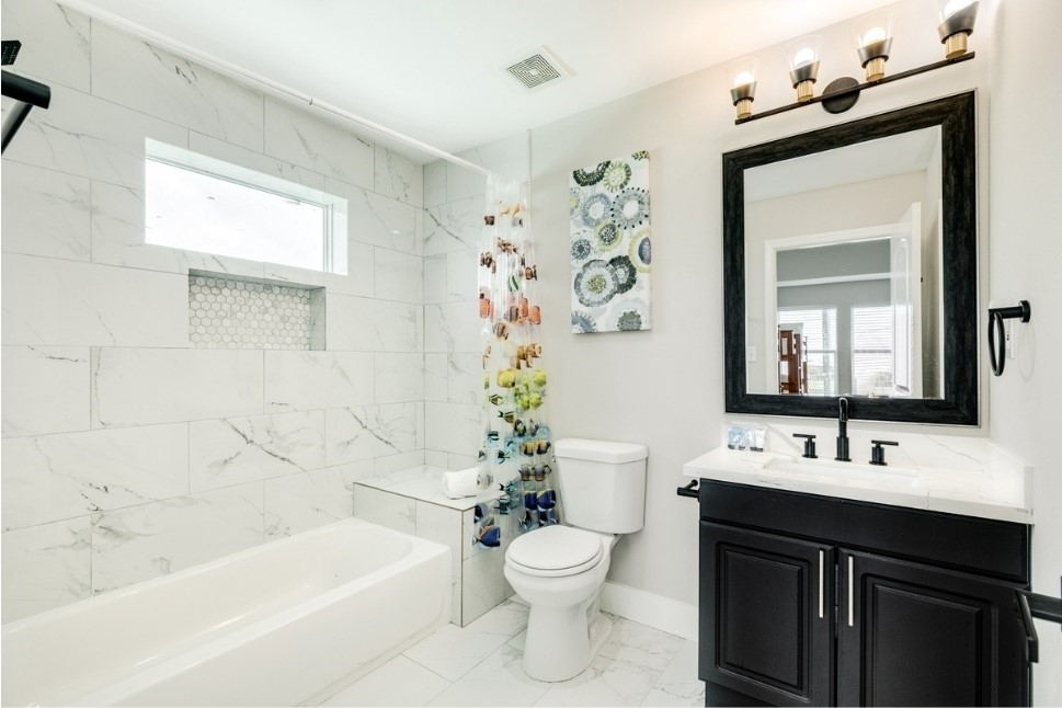 23327 Termini-San Luis Pass Road Galveston, TX 77554 - Photo 26 of 39 a bathroom with a sink a toilet and a bathtub