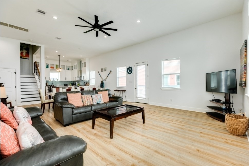 23327 Termini-San Luis Pass Road Galveston, TX 77554 - Photo 4 of 39 a living room with furniture and a wooden floor