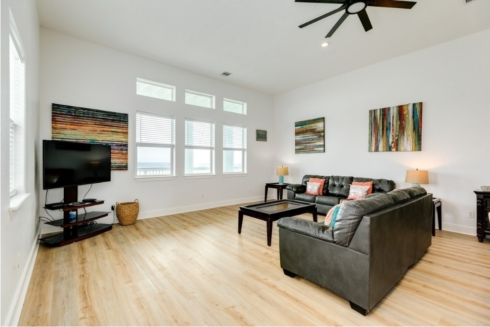 23327 Termini-San Luis Pass Road Galveston, TX 77554 - Photo 6 of 39 a living room with furniture and a flat screen tv
