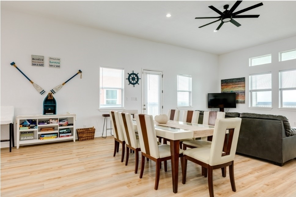 23327 Termini-San Luis Pass Road Galveston, TX 77554 - Photo 7 of 39 a view of a dining room with furniture and wooden floor