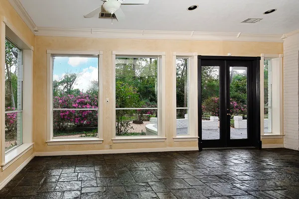 a view of empty room with windows